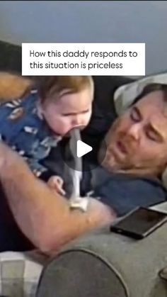 a man laying in bed with a baby on his lap and texting how this daddy responds to this situation is priceless