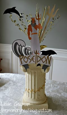 a vase with some paper cutouts on top of it