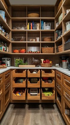 a kitchen with wooden cabinets and drawers filled with lots of food in the pantry area