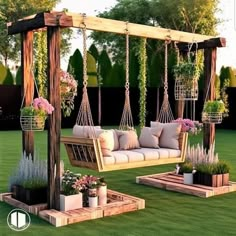 an outdoor swing chair with pillows and potted plants in the grass, next to some wooden planters