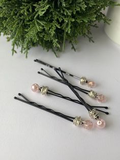 Welcome to Tabor And Lark!   This Bobby Pin set is a classic set of faux pearls and crystals in a gorgeous soft pink color.  It would make a perfect gift to give to a mother or a bride-to-be.  It would also just help with keeping your bangs out of your eyes as you grow your hair out. Either way a classic hair accessory.  🌿The set pictured is made with the Blackest Black Bobby Pins and Silver tone Wire. 🌿Dimensions- Bobby Pins are are approximately 2 inches long.  🌿The set will arrive in an or Pink Barrettes, Growing Your Hair Out, Hair Slides, Soft Pink Color, Bobby Pin, Hair Slide, Crystal Hair, Pink Pearl, Organza Bags