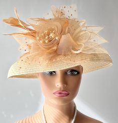 The featured listing is a dressy wide brimmed pale gold straw hat. A crinoline design in amber color sits at the side of the hat. Some sinamay, some feathers, amber netting also adorns the hat. All the elements combining  making the hat so interesting and softly dramatic. This  hat is  beautiful for the Kentucky Derby or  for  Sunday  Church.  It is also perfect for an Easter Hat, Tea Party hat,Wedding Party Hat, Fancy Dress Hat, Retro Hat, Downton Abbey hat, Audrey Hepburn style hat and any oth Luxury Pinched Crown Hat For Kentucky Derby, Luxury Cream Top Hat For Kentucky Derby, Luxury Cream Hat For Kentucky Derby, Wedding Dress With Wide Brim Hat, Crinoline Hats, Audrey Hepburn Hat, Gold Straws, Hat Tea Party, Retro Hat