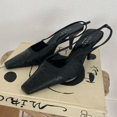 Absolutely Iconic Vintage Gucci Slingback Heels From 1998, The Tom Ford Era! Size 38. Heel Height Is About 3”. These Are Super Rare And A Collectors Item - I Can’t Find Another Pair Online Like Them (There Are A Few Of The Same Shoe In Different Colorways For $1-3k On 1st Dibs). Shoes Are Crocodile Leather On The Shoe Tips With The Iconic “Gg” Logo In Satin Fabric. Comes With The Original Box And Dust Bag! Really Great Condition - Only Noticeable Wear Is On The Soles. These Shoes Are The Original Version Of The Current Style Of Gg Slingbacks! Black Leather Gucci Slingback Pumps, Gucci Black Slingback Pumps With Branded Heel, Gucci Black Slingback Pumps With Heel Strap, Gucci Black Slingback Pumps, Spring Gucci High Heel Slingback Pumps, Gucci Pointed Toe Slingback Pumps For Spring, Gucci Spring Slingback Pumps With Heel Strap, Gucci High Heel Slingback Pumps For Spring, Spring Gucci Slingback Pumps With Heel Strap