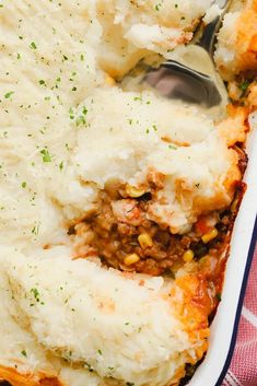 a casserole dish with mashed potatoes and meat