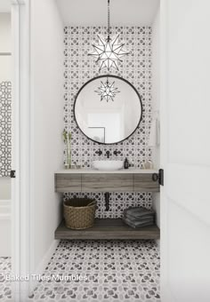 a bathroom with a sink, mirror and tiled flooring in black and white colors