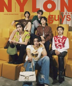 the group of young men are posing for a magazine cover photo with their purses