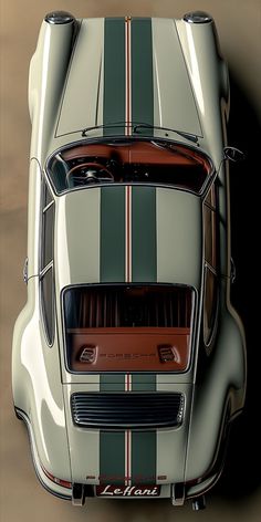 an overhead view of a sports car with stripes on it's hood and taillights