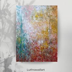 an abstract painting is displayed on a wall with the words luttrawallart above it