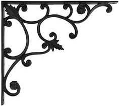 an ornate iron shelf bracket with flowers and leaves on the top, isolated against a white background