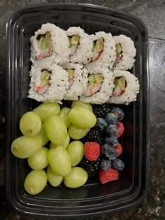 sushi and grapes in a plastic container