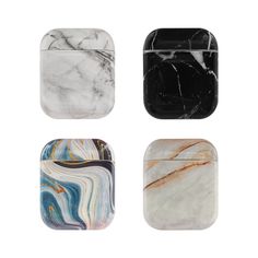 four marble coasters with different designs on them