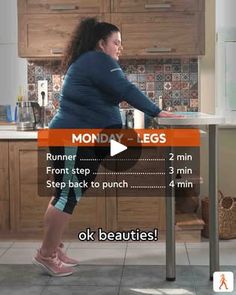 a woman standing at a kitchen table in front of a counter with an egg on it