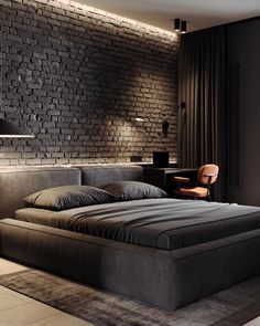 a bedroom with brick walls and a large bed in the middle, along with a chair