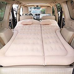 an inflatable mattress is placed on the back of a vehicle