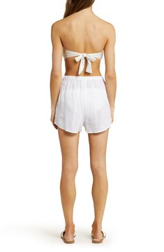 These easy-on cover-up shorts woven from lightweight linen are a must-pack companion for your next sunny getaway. 2 1/2" inseam; 24" leg opening; 13 1/2" front rise; 16 1/2" back rise (size Medium)   Elastic waist   Front slant pockets   Unlined   100% linen   Hand wash, dry flat   Imported   As a member of 1% for the Planet, Vitamin A has committed to donating 1% of its annual sales to nonprofit partners in support of environmental solutions Beachy Bottoms With Built-in Shorts For Beach, Beachwear Bottoms For Warm Weather And Beach, Beachwear Bottoms For Warm Weather Vacation, Beachy Shorts For Warm Beach Weather, Warm Weather Beachwear Bottoms For Beach, Beach Shorts For Warm Weather, Bermuda Bottoms For Beach In Summer, Summer Beach Bermuda Bottoms, Bottoms With Built-in Shorts For Summer Vacation