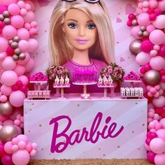 a barbie birthday party with pink balloons and decorations