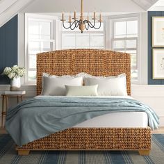 a bedroom with blue walls and wicker furniture