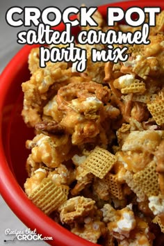 a red bowl filled with crock pot salted caramel party mix