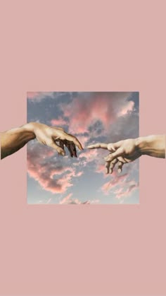 hands reaching out to touch each other in front of a pink sky with white clouds