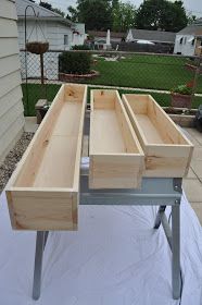 the table is made out of plywood and has drawers on each side for storage