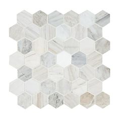 white marble hexagon tiles with grey and gray veining on the backsplash