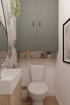 a white toilet sitting next to a sink in a bathroom under a mirror and cupboards