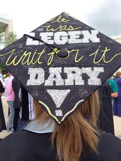 a woman wearing a graduation cap with writing on it