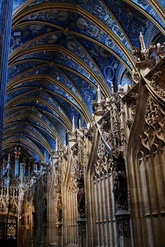 the inside of a cathedral with blue and white walls