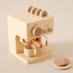 an old fashioned coffee machine with four cups