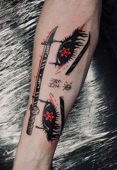 a person with a tattoo on their arm holding a knife