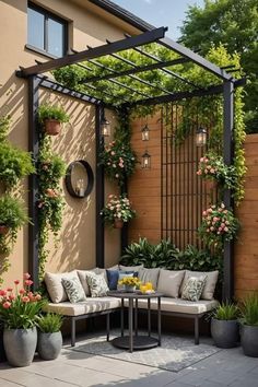 an outdoor seating area with potted plants and flowers