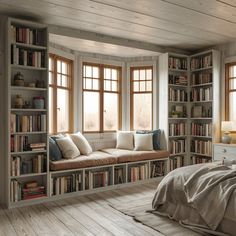 a bed sitting in a bedroom next to a book shelf filled with lots of books