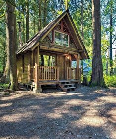 a small cabin in the woods surrounded by trees