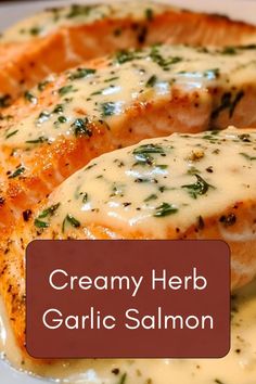 creamy herb garlic salmon on a white plate