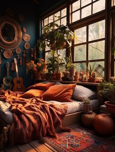 a bedroom with lots of potted plants in the window sill and guitar on the bed