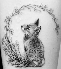 a black and white photo of a fox on the thigh