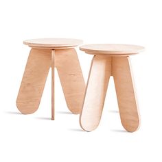 two wooden stools sitting next to each other