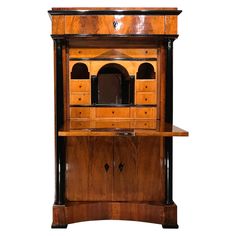 an old fashioned wooden cabinet with drawers and cupboards on the front, side view