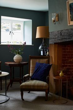 a living room filled with furniture and a fire place