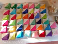 colorful napkins are laid out on the table to be used as decorations for a party