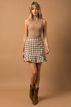 This skirt is absolutely adorable and such a statement for fall/winter! Houndstooth is such a trend right now and we are here for it. This skirt also has a friend...check out the matching jacket that you could pair with it! Chic Tiered Skirt For Fall, Trendy Winter Houndstooth Skirt, Winter Trendy Houndstooth Skirt, Chic Ruffled Fall Skirt, Chic Fall Ruffled Skirt, Houndstooth Mini Skirt For Fall, Fall Fitted Skirt With Houndstooth Pattern, Chic Ruffled Skirt For Fall, Trendy Brown Mini Skirt For Fall