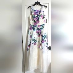 Beautiful Brand New Dress Floral Printed Gown Size 8 White A-line Summer Gown, White Sleeveless Spring Gown, White Sleeveless Gown For Spring, Sleeveless White Gown For Spring, White A-line Maxi Dress For Prom, Floral Print Formal Ball Gown Evening Dress, White A-line Prom Maxi Dress, White Ball Gown Dress For Evening, White Prom Season Dress