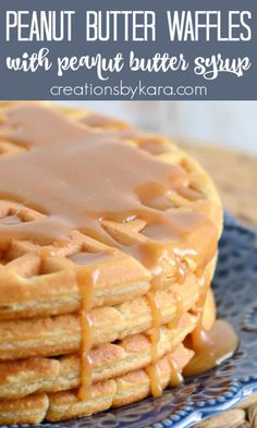 a stack of peanut butter waffles on a blue plate with caramel drizzle