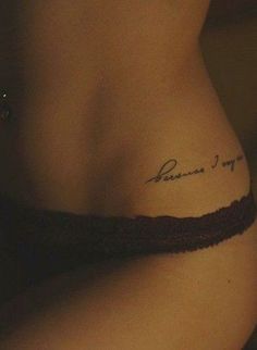 a woman with a tattoo on her stomach that reads, because i'm not