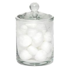 a glass jar filled with white cotton balls