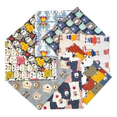 several pieces of fabric with animals and bears on them, all in different colors or patterns