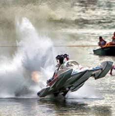 a speed boat being pulled by a water skier