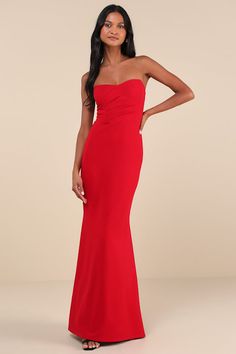 Heads are sure to turn when you walk in wearing the Lulus Iconic Arrival Red Strapless Bustier Mermaid Maxi Dress! Stretchy, crepe-knit fabric shapes this dramatic dress that has a bustier-inspired bodice with hidden supportive boning and no-slip strips. Pleated details decorate the front, while the back boasts sheer mesh panels for an eye-catching accent. Fitted waist tops a figure-skimming mermaid skirt that finishes at a maxi hem. Hidden zipper/clasp at back. Fit: This garment fits true to size. Length: Floor length. Size medium measures 54" from top to bottom. Bust: Great for any cup size. Waist: Fitted - very fitted at natural waist. Hip: Fitted - stretchy fabric allows room for hips. Undergarments: May be worn with an adhesive bra, petals, or no bra. Fabric: Fabric has some stretch. Dress With Bustier, Red Mermaid Dress, Dramatic Dress, Maxi Dress Strapless, Dramatic Dresses, Ruffle Prom Dress, Strapless Bustier