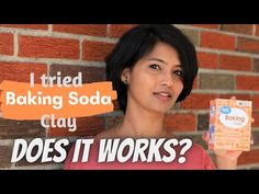 a woman holding up a box of baking soda in front of a brick wall with the words, tried baking soda clay does it works?