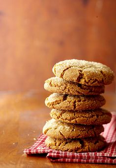 a stack of cookies sitting on top of a wooden table